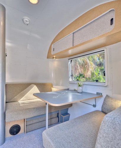 Airstream’s New Baby Camper Fits A Kitchen And A Bed For Two Into 17 Feet