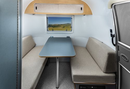 Airstream’s New Baby Camper Fits A Kitchen And A Bed For Two Into 17 Feet