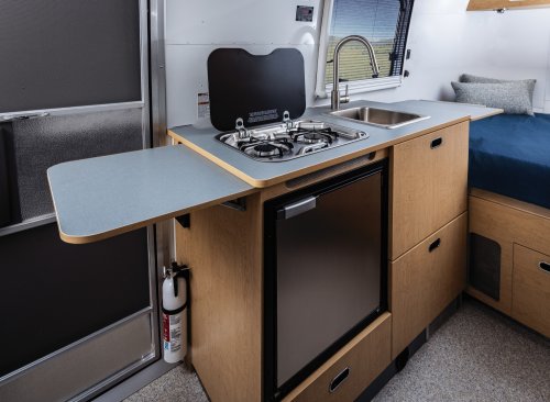 Airstream’s New Baby Camper Fits A Kitchen And A Bed For Two Into 17 Feet