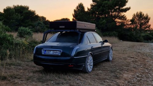 This Lancia Was Built For Italian Politicians, Now It Sleeps Two In A Field