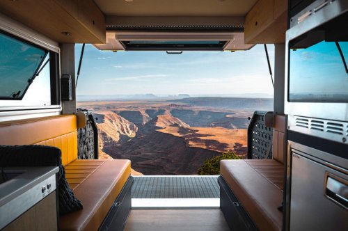 $300K Camper Has A Fold-Out Balcony For The Middle Of Nowhere And A Hemi To Get You There