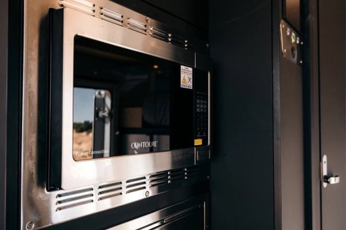 $300K Camper Has A Fold-Out Balcony For The Middle Of Nowhere And A Hemi To Get You There