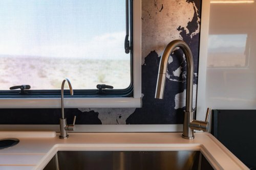 $300K Camper Has A Fold-Out Balcony For The Middle Of Nowhere And A Hemi To Get You There