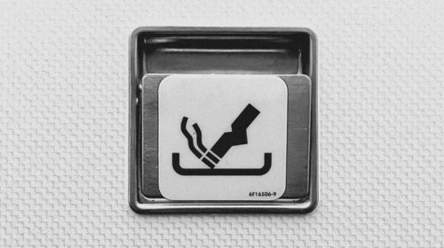 Airplane Ashtrays Still Exist Because People Have A Hard Time Following Rules