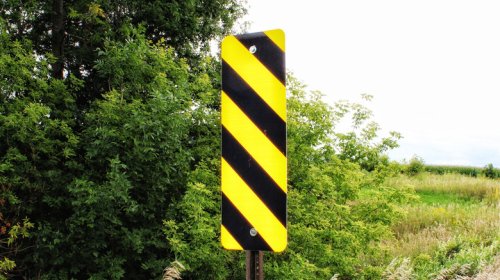 Here's What Those Diagonal Black And Yellow Striped Road Signs Are Telling You