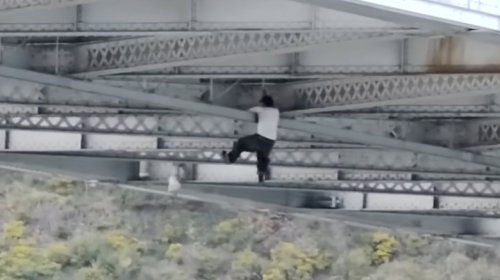Suspected Car Thief Spider-Mans Through Underside Of Bridge Trying To Escape Police