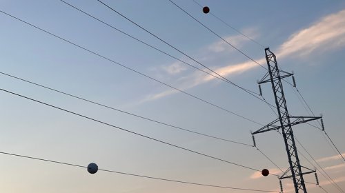 The Reason Power Lines Have Orange Balls Is Almost As Interesting As How They Get There