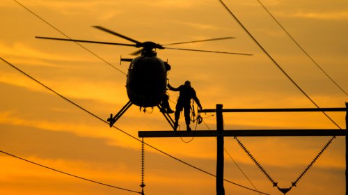 The Reason Power Lines Have Orange Balls Is Almost As Interesting As How They Get There