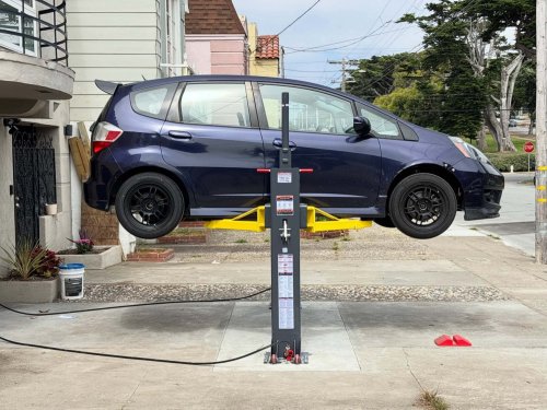 This Disappearing Driveway Lift Setup Is a Next-Level Home Mechanic Move