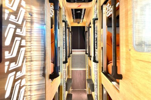 Juragan99 Trans Rilis Bus Bioskop Berjalan di Busworld 2026