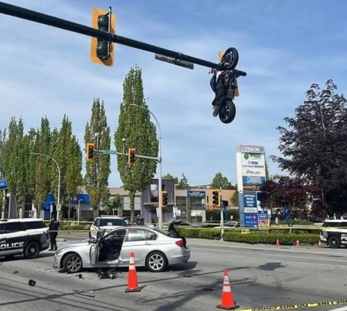 BMW, Motorcycle Left Hanging from Traffic Light After Dramatic BMW 3-Series Crash