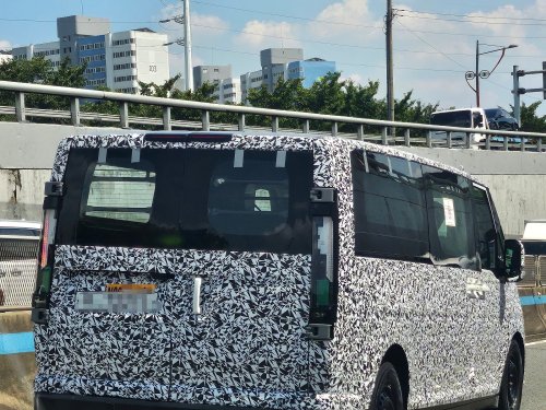 Kia's larger EV van caught with less camo ahead of debut [Images]