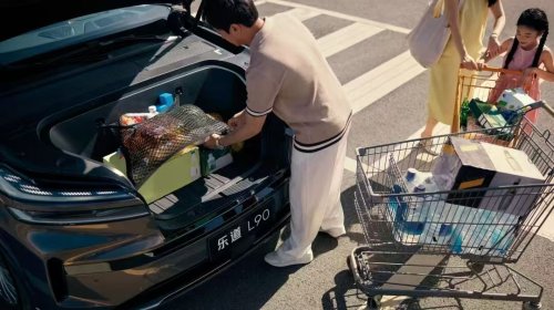 Who is defining the all-electric vehicle era?