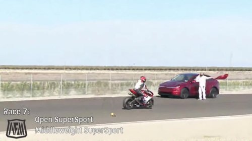 Tesla driver gets lost, drives onto track during motorcycle race