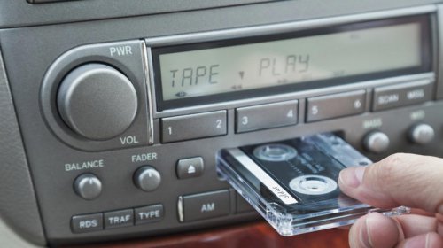 When did automakers switch from 8-track players to cassette decks?