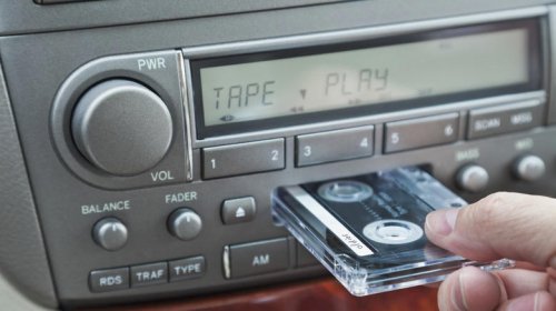 When did automakers switch from 8-track players to cassette decks?