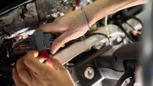 I paid for a certified pre-owned SUV, then found an aftermarket alarm spliced into the wiring harness