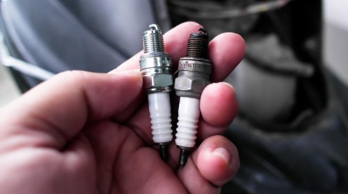 What causes spark plugs to turn black?