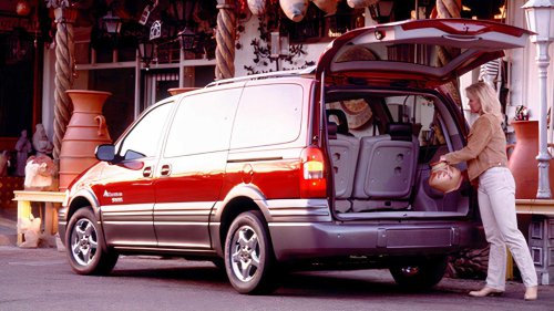 A first-gen Sedona is the cheapest three-row minivan out there