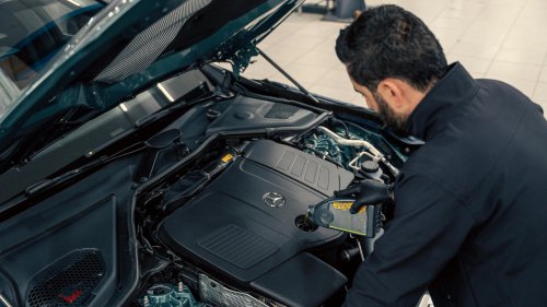 My car smells like burning after an oil change and the shop says it will go away