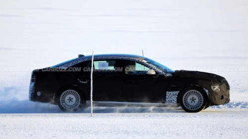New Genesis G80 spied hiding hybrid powertrain under heavy camo