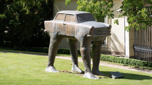 This statue of a Trabant with legs will absolutely haunt your dreams