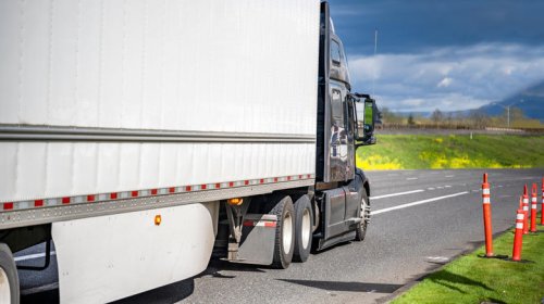 Why do some semi-truck trailers have side skirts?