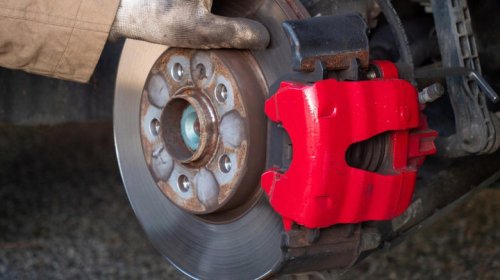 What does a brake caliper piston do and how many does the average car need?