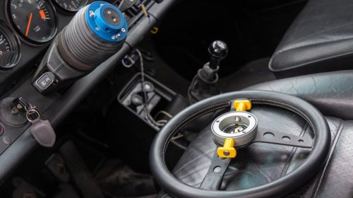 Why do people put knobs on steering wheels?