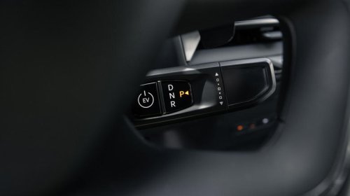 Why did most car manufacturers stop using column-mounted gear shifters?