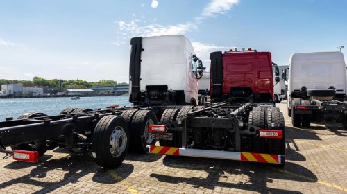 Why do some semi-trucks have stretched frames?