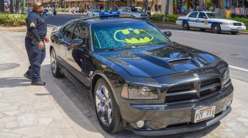 Why do police in Hawaii drive their own cars?