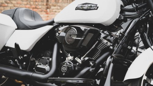 What does a compensator do on a Harley-Davidson?
