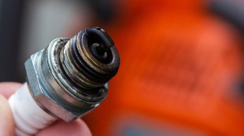 Why can't spark plugs fire when completely soaked?
