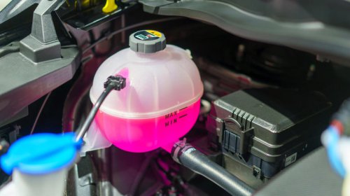 Do you need to drain old coolant before adding more to your car?