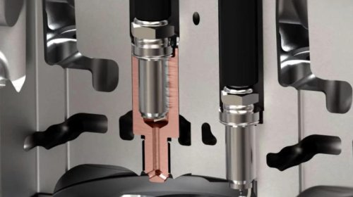 What is turbulent jet ignition and how is it different from an everyday spark plug?