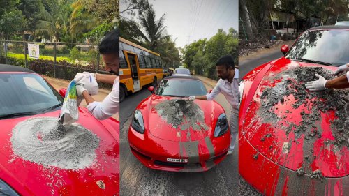 Indian man mixes concrete on the hood of his Porsche because he is fed up