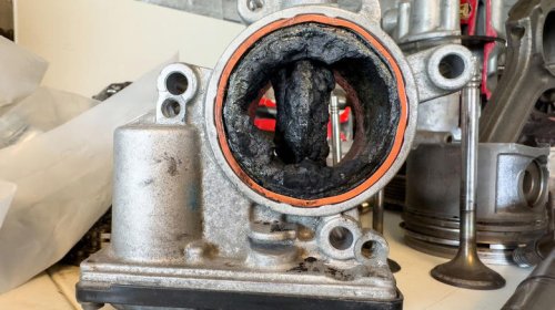 What engine parts are most susceptible to carbon buildup?