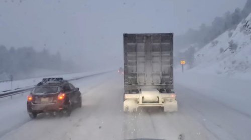 Why do most truckers choose snow chains over winter tires?