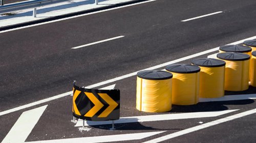 What those yellow barrels on the highway are for