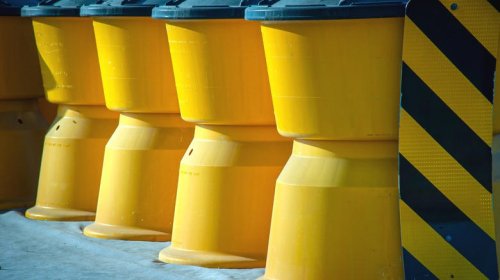 What those yellow barrels on the highway are for