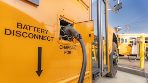 What type of engines do school buses have under the hood?