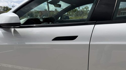 Why did car brands ditch traditional door handles?
