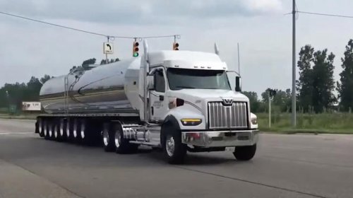 Why do semi trucks in Michigan have so many wheels?