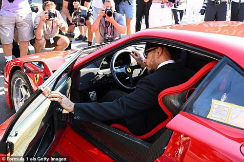 Lewis Hamilton poses with his new £3M Ferrari F40 at the Italian Grand Prix