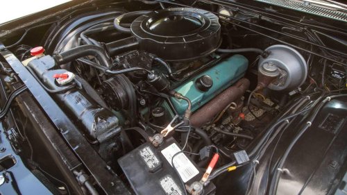 Chrysler's wood-and-chrome luxury sedan hid a 360-HP wedge and a stick