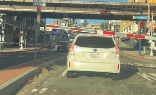 Driver Inches Toward Oncoming Train at Railroad Crossing in Viral Video That Has Everyone Screaming at Their Screens