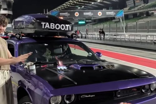 Man Showers at an F1 Circuit Using a Dodge Challenger's Trunk — There's Also a Stove on the Hood