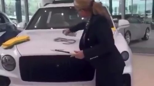 Lady at the Dealership Spray-Painted a Dollar Sign on a Bentley. Then She Set It on Fire. There's a Method to the Madness