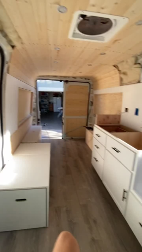 I spent weeks turning an empty metal box into a rolling home. Here is how it looks inside.